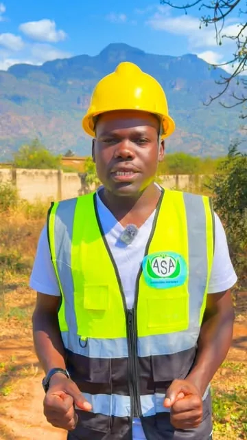 Creator in a safety vest in the hills