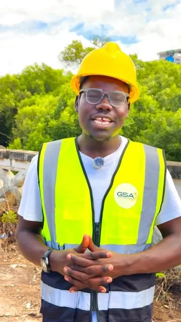 Creator in a hard hat on a site visit